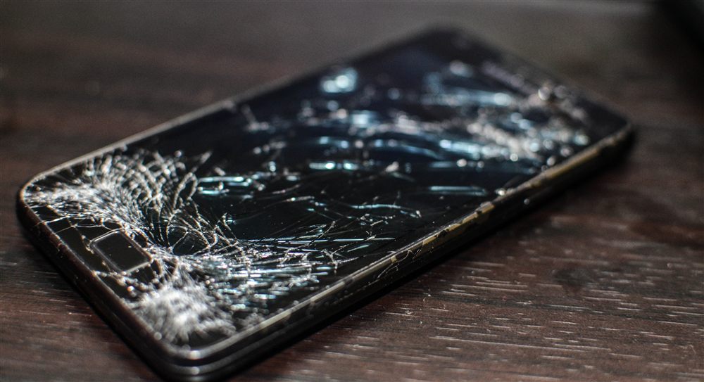 Cracked phone screen ready for replacement